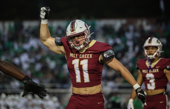 Mill Creek's Luke Mentz (11) celebrates a defensive stop against Buford as Trajen Greco looks on. 11/13/2023